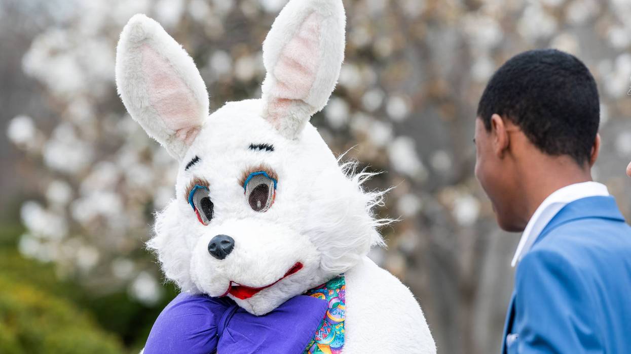 Easter bunny costume and people by the basilica of the National Shrine of the Immaculate Conception Catholic church outside on Easter