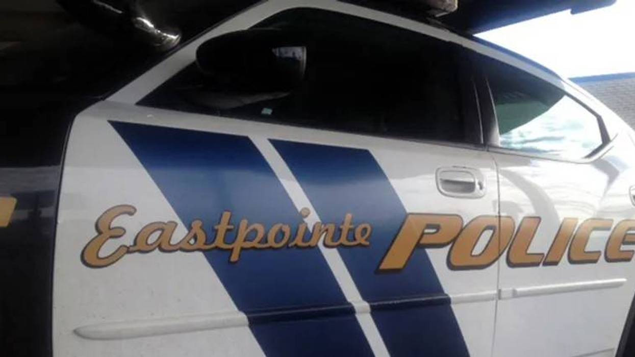 Eastpointe Police car side with white, blue, and gold 'Eastpointe POLICE' lettering.