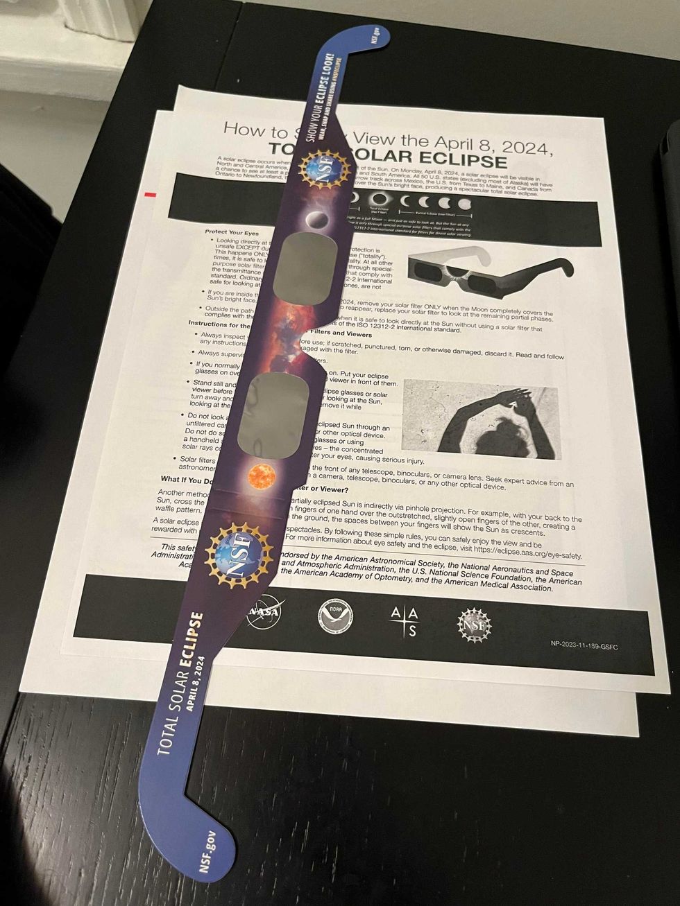 Eclipse glasses and information provided by a Queens Public Libarary branch in anticipation of the April 8 event.
