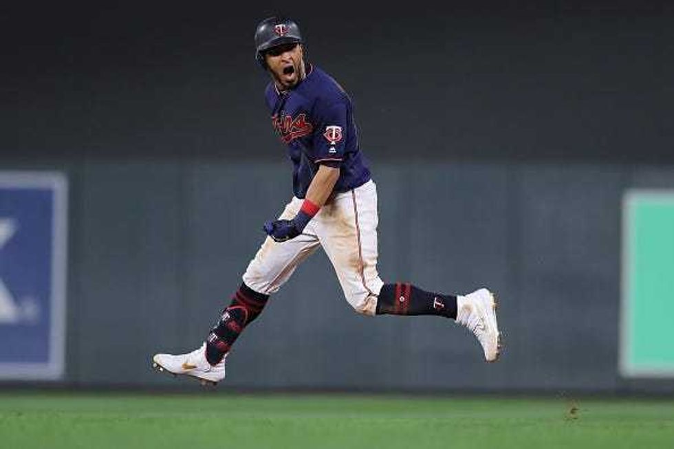 Eddie Rosario #20 of the Minnesota Twins celebrates after his solo home run against the New York Yankees in the eighth inning in game three of the American League Division Series at Target Field on October 07, 2019 in Minneapolis, Minnesota.