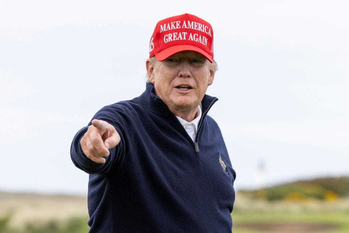 (EDITOR'S NOTE: Alternative crop of image #1252535245) Former U.S. President Donald Trump gestures during a round of golf at his Turnberry course on May 2, 2023 in Turnberry, Scotland. Former U.S. President Donald Trump is visiting his golf courses in Scotland and Ireland. Back in the United States, he faces legal action on 34 counts of falsifying business records. (Photo by Robert Perry/Getty Images)