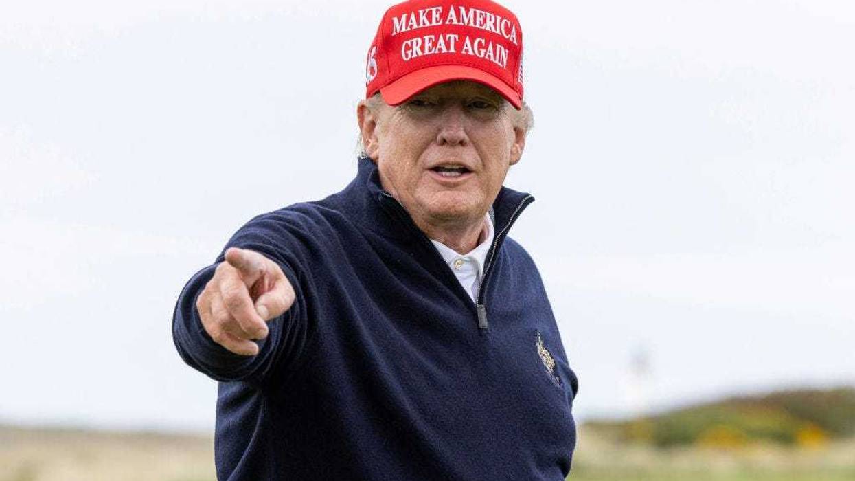 (EDITOR'S NOTE: Alternative crop of image #1252535245) Former U.S. President Donald Trump gestures during a round of golf at his Turnberry course on May 2, 2023 in Turnberry, Scotland. Former U.S. President Donald Trump is visiting his golf courses in Scotland and Ireland. Back in the United States, he faces legal action on 34 counts of falsifying business records. (Photo by Robert Perry/Getty Images)