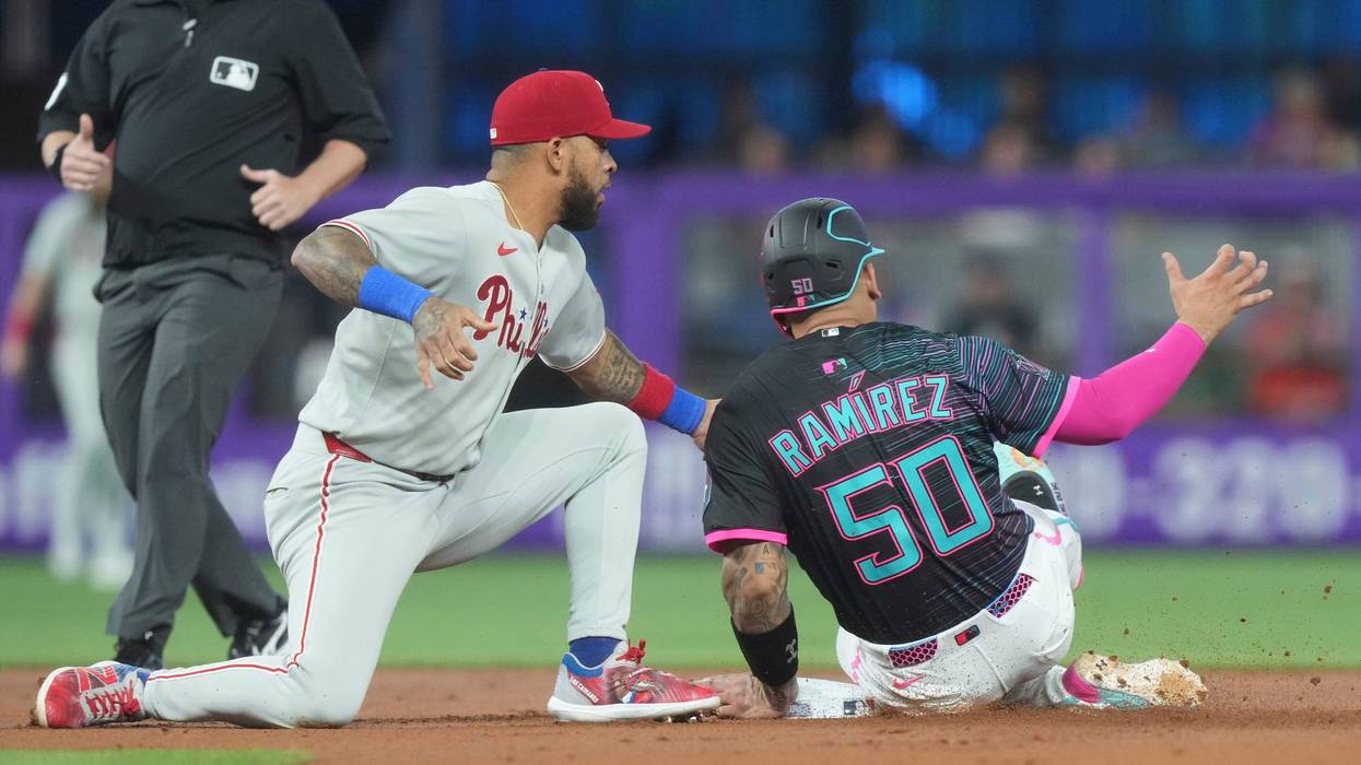 Edmundo Sosa tags Miami Marlins' Agustín Ramírez (50) as he tries to steal the base during the first inning of a baseball game Saturday, Sept. 6, 2025, in Miami.