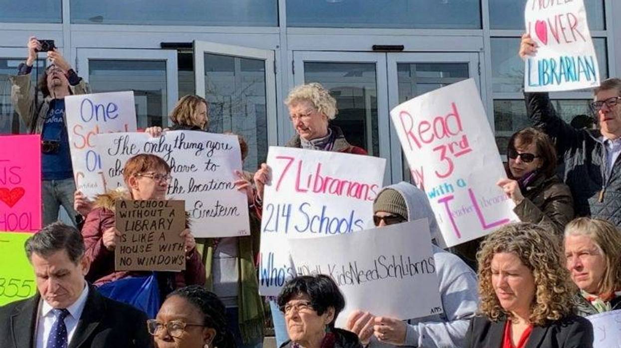Educators rallied on the steps of Philadelphia School District headquarters, calling on schools to restore librarians to schools.