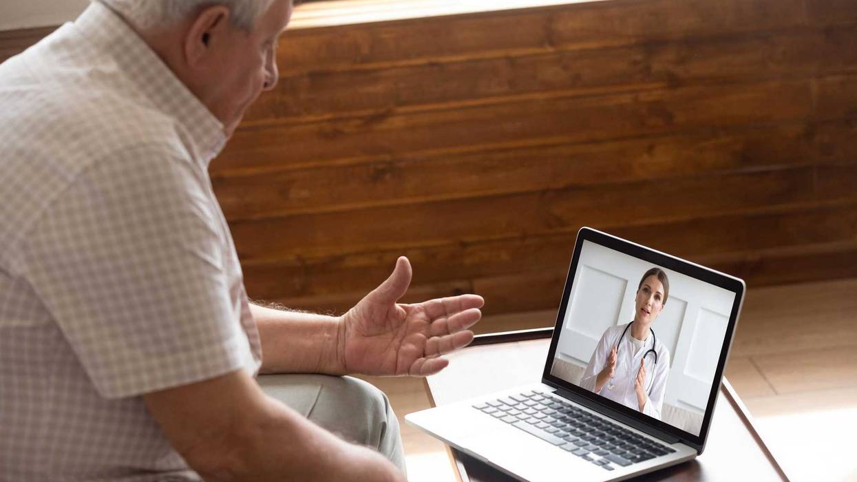 Elderly man using telemedicine