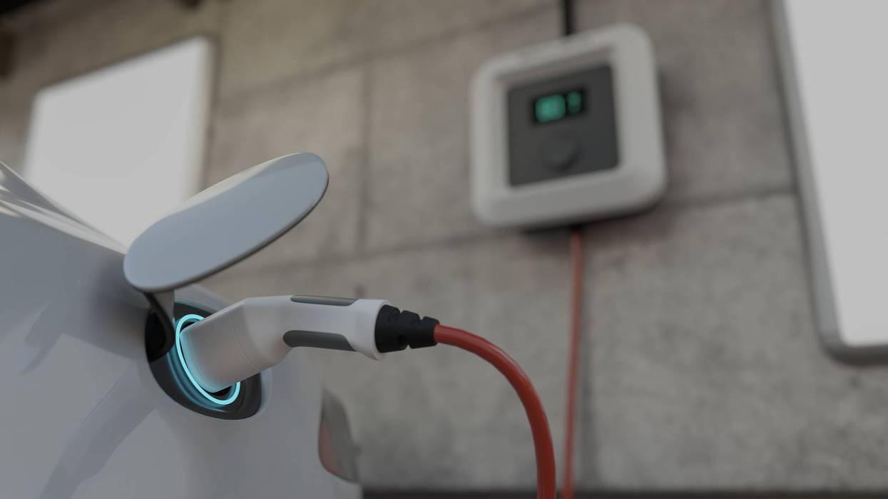 electric car recharging at station.