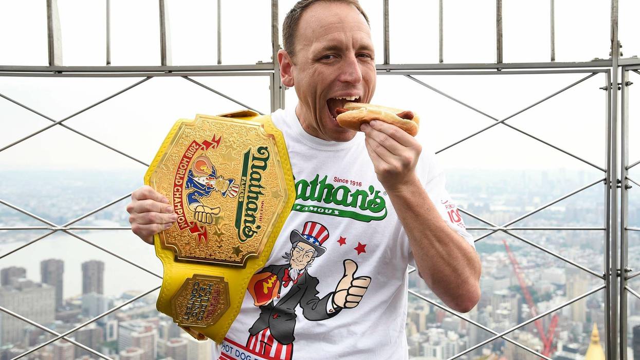 Eleven-time and defending men's champion Joey Chestnut poses on the 86th floor observation deck during the Nathan's Famous international Fourth of July hot dog eating contest weigh-in at the Empire State Building on July 3, 2019.