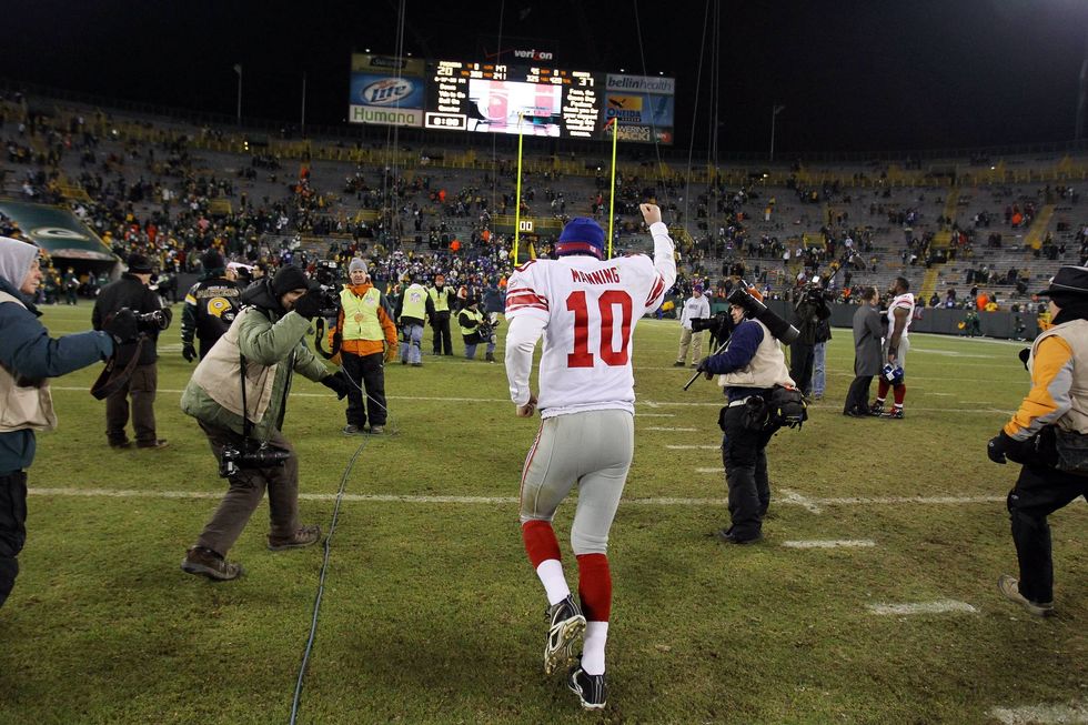 Eli Manning celebrates after the Giants beat the Green Bay Packers in the 2011 NFC title game