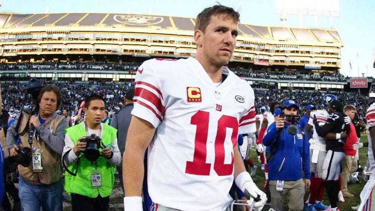 Eli Manning leaves the field after the loss against the Oakland Raiders at Oakland Coliseum.