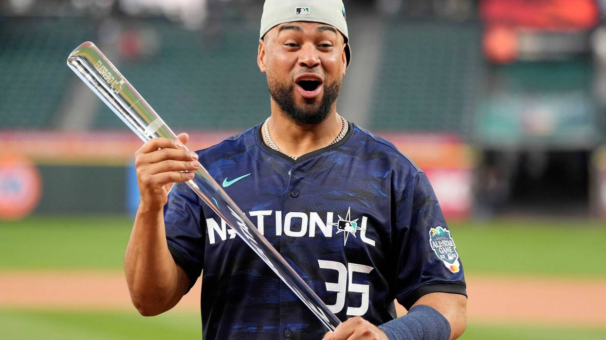 Elias Diaz with the All-Star Game MVP trophy