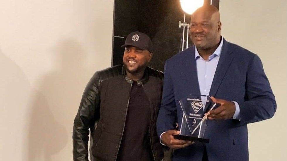 Elijah Everett poses with Shaquille O