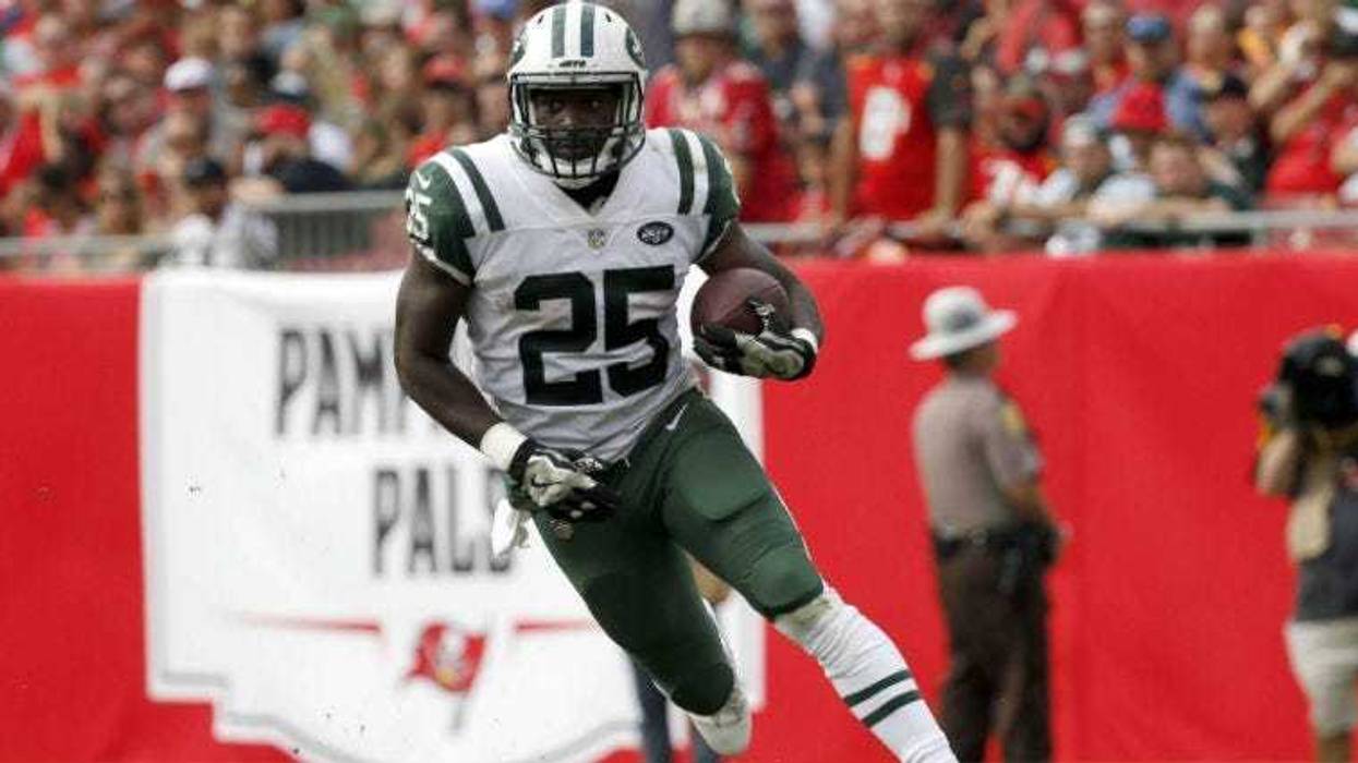 Elijah McGuire runs with the ball against the Tampa Bay Buccaneers during the second half at Raymond James Stadium.