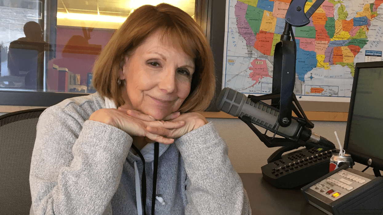 Ellen Schenk at the mic in the KMBZ Radio studio