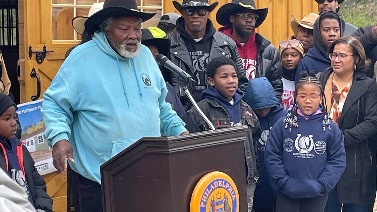 Ellis Ferrell Jr. surrounded by members of the Fletcher Street Urban Riding Club