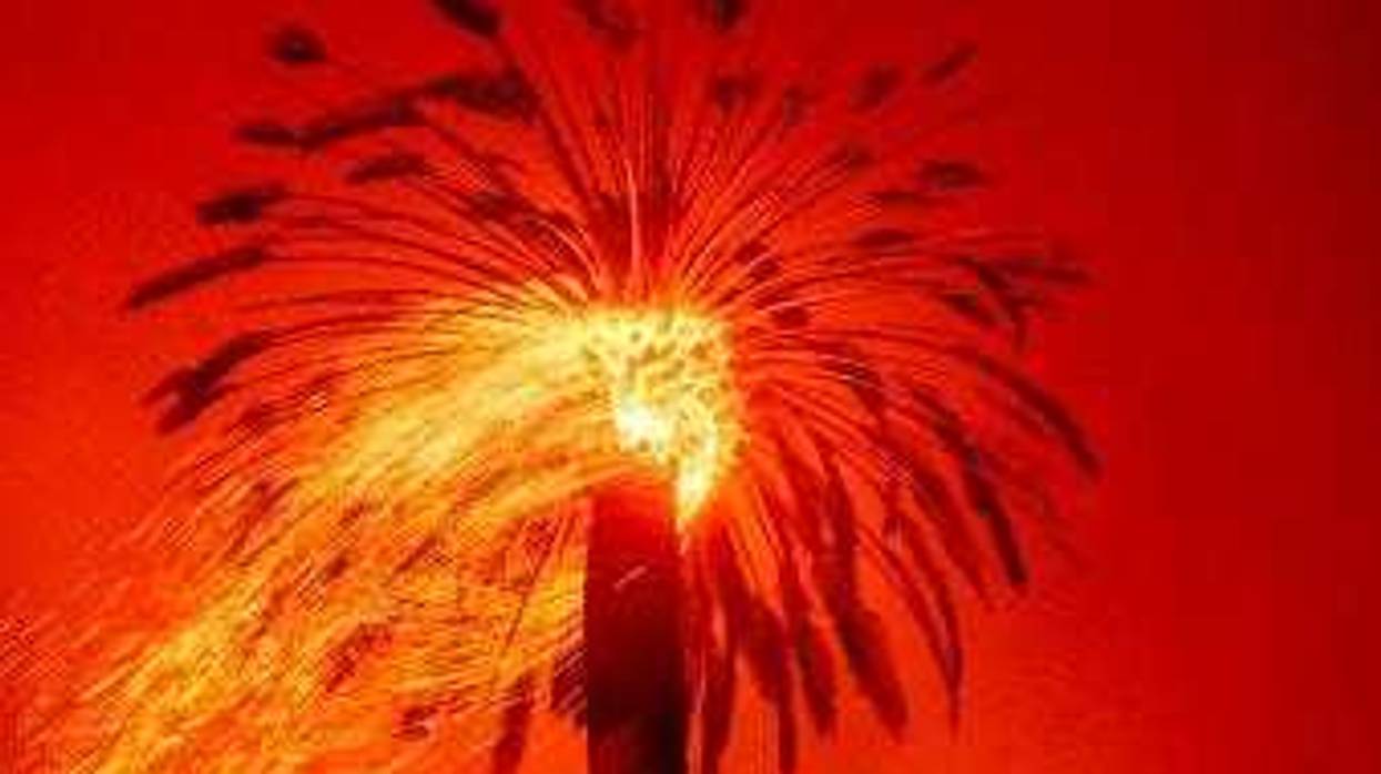 Embers fly from a tree as the Glass Fire burns in St. Helena, Calif., Sunday, Sept. 27, 2020. (AP Photo/Noah Berger)