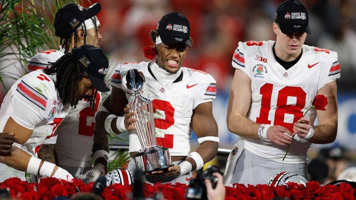 Emeka Egbuka #2 of the Ohio State Buckeyes holds the Leishman Trophy after defeating the Oregon Ducks 41-21 during the Rose Bowl Game Presented by Prudential at Rose Bowl Stadium on January 01, 2025 in Pasadena, California.