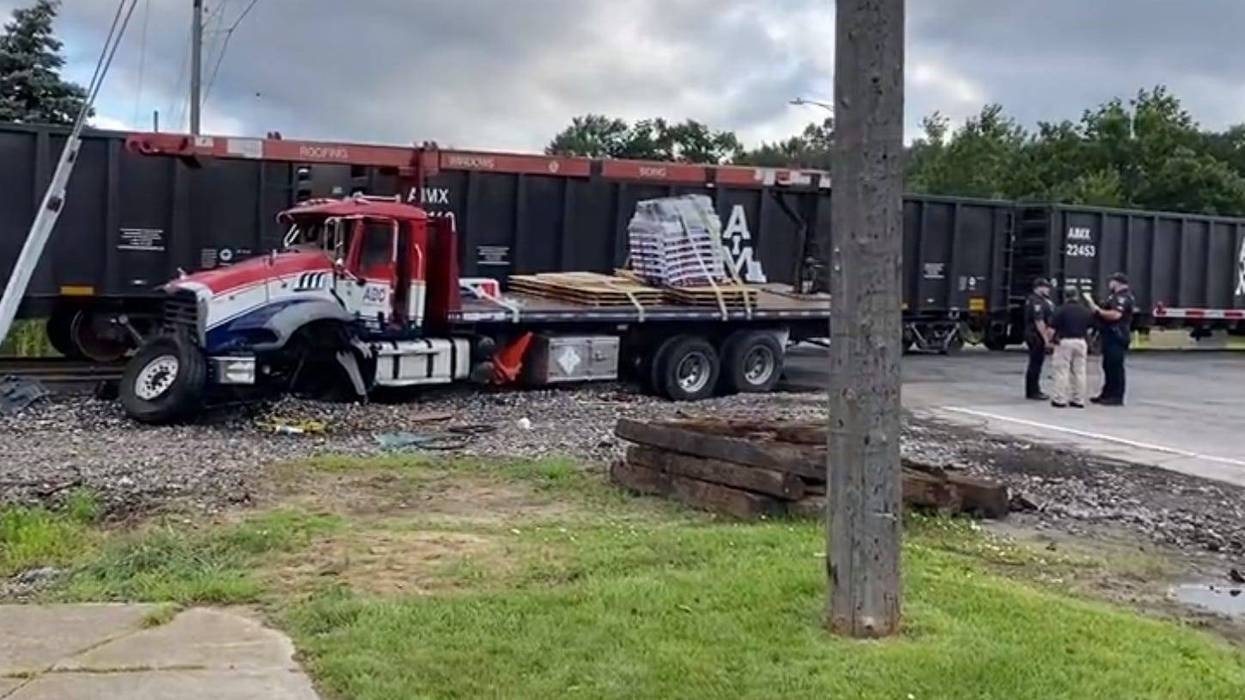 Emergency crews are at the scene of a major Downriver collision after a train rammed into a semi-truck early Friday morning.