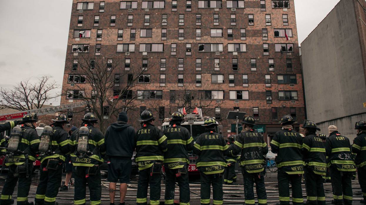 Emergency first responders outside a fire at the 19-story Twin Parks North West tower on Jan. 9, 2022