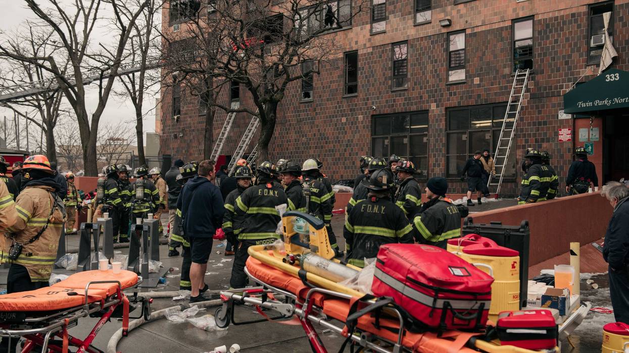 Emergency first responders remain at the scene of an intense fire at a 19-story residential building that erupted in the morning on Jan. 9, 2022 in the Bronx