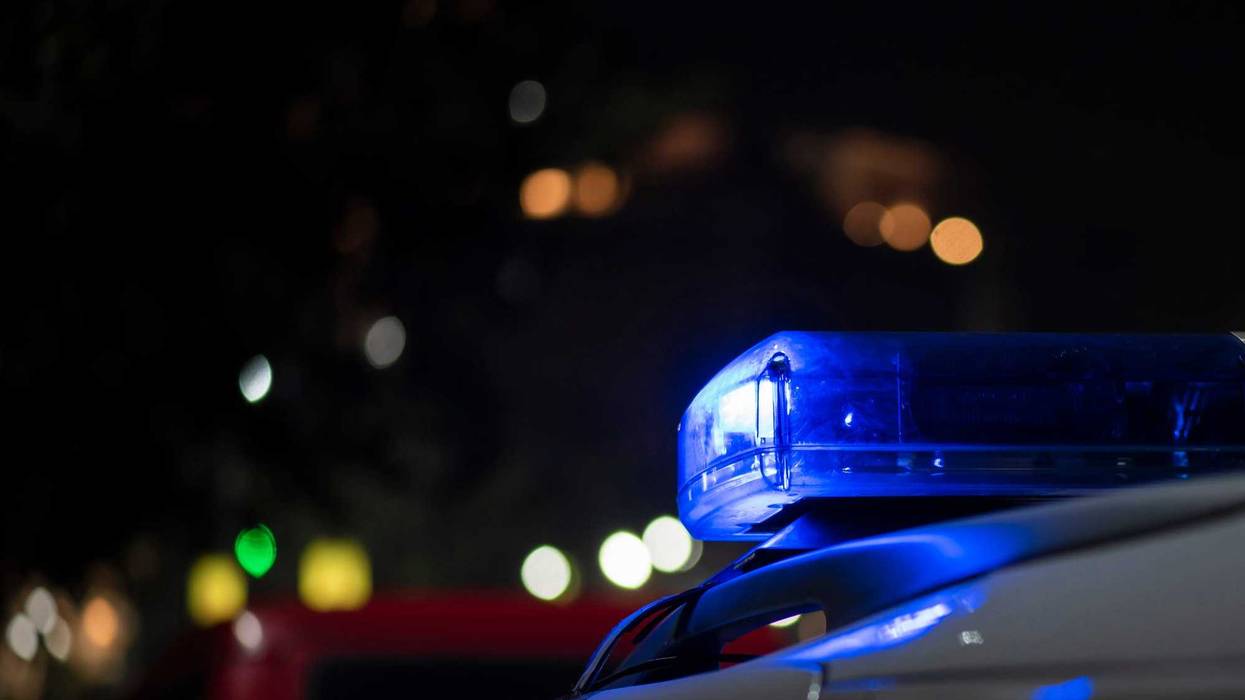 Emergency light of police patrolling car on street in night