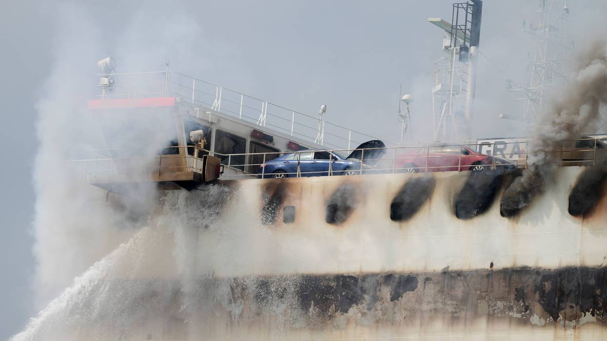 Emergency personnel battle against a fire aboard the Italian-flagged Grande Costa d'Avorio cargo ship at the Port of Newark, July 7, 2023, in Newark, N.J.