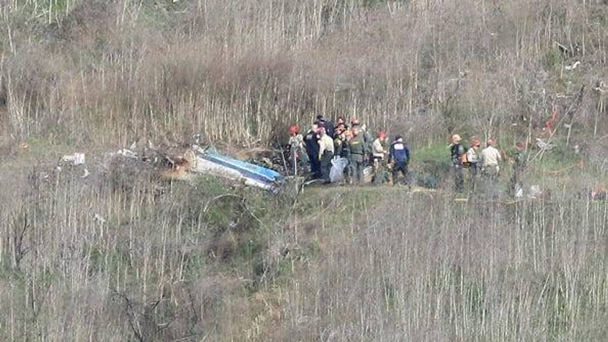 Emergency personnel work at the helicopter crash site that claimed the life of former NBA great Kobe Bryant on January 27, 2020 in Calabasas, California. Bryant, 41, his daughter Gianna, 13, and seven others perished in the accident yesterday.
