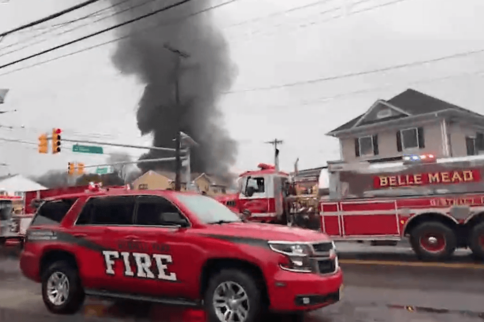 Emergency responders assist at the scene of a mattress fire in New Brunswick on Wednesday.