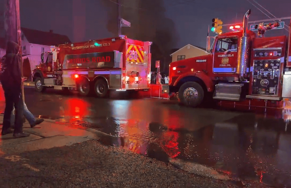 Emergency responders assist at the scene of a mattress fire in New Brunswick on Wednesday.