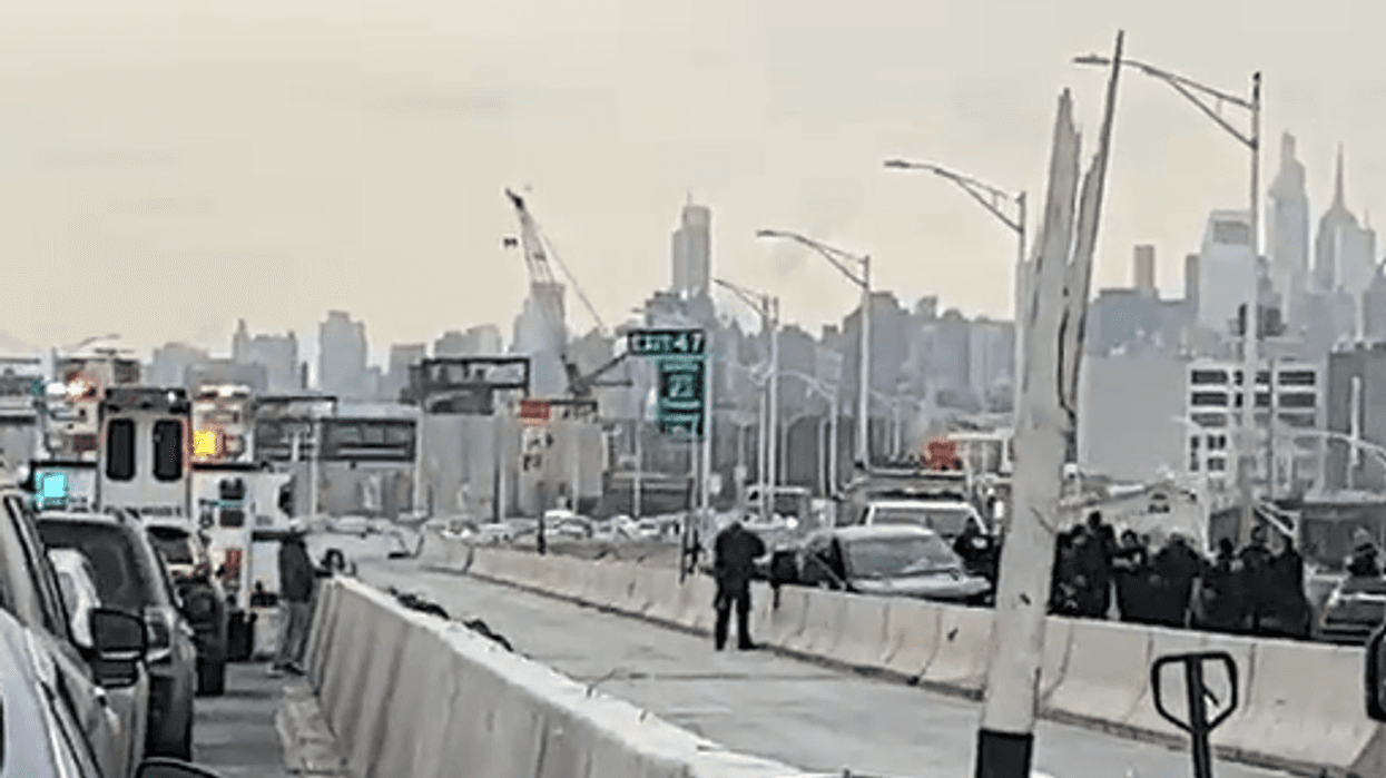 Emergency responders gather around the crash on the Bruckner Expressway.