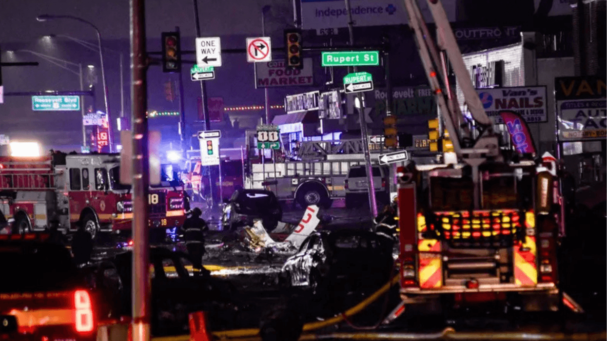 Emergency response crews on Cottman Avenue investigate the wreckage of the medical jet crash on Jan. 31, 2025.