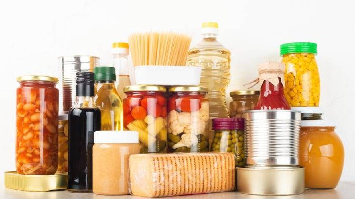 Emergency survival food set on white kitchen table