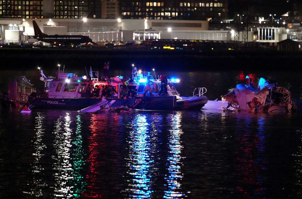 Emergency units respond after a passenger aircraft collided with a helicopter in the Potomac River near Ronald Reagan Washington Airport on January 30, 2025 in Arlington, Virginia
