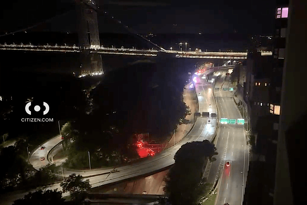 Emergency vehicles are seen in the area where the man fell