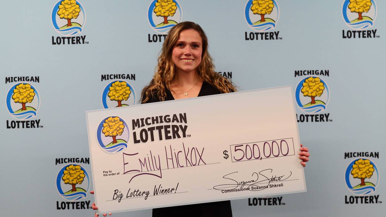 Emily Hickox with Michigan Lottery check