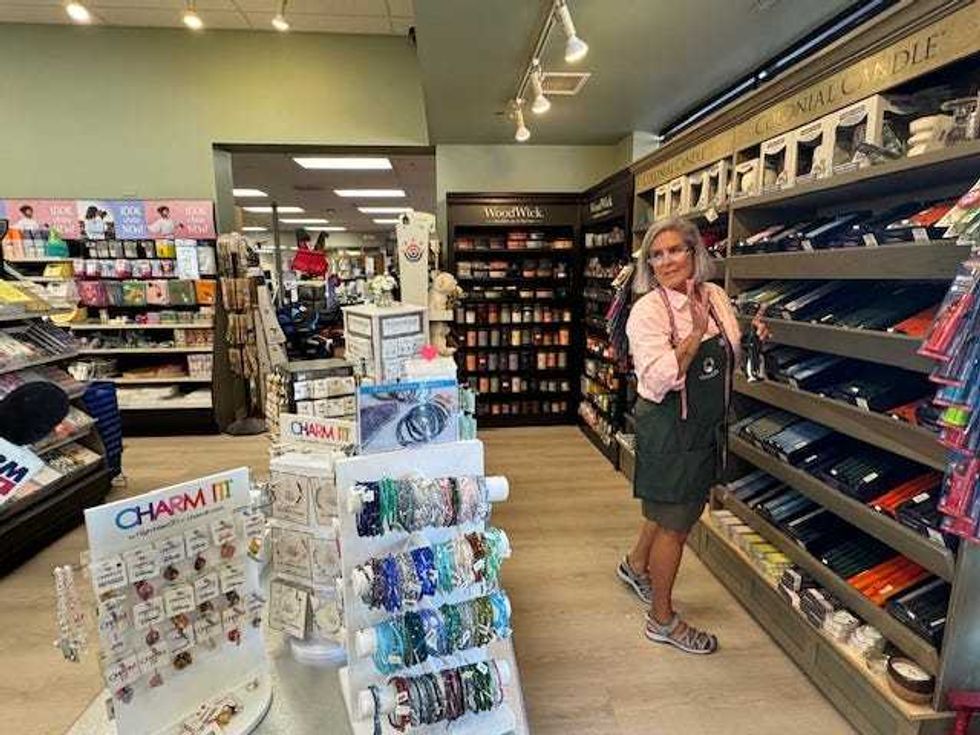 Employee Kathy LeFredo works in the candle & jewelry section of Oswald