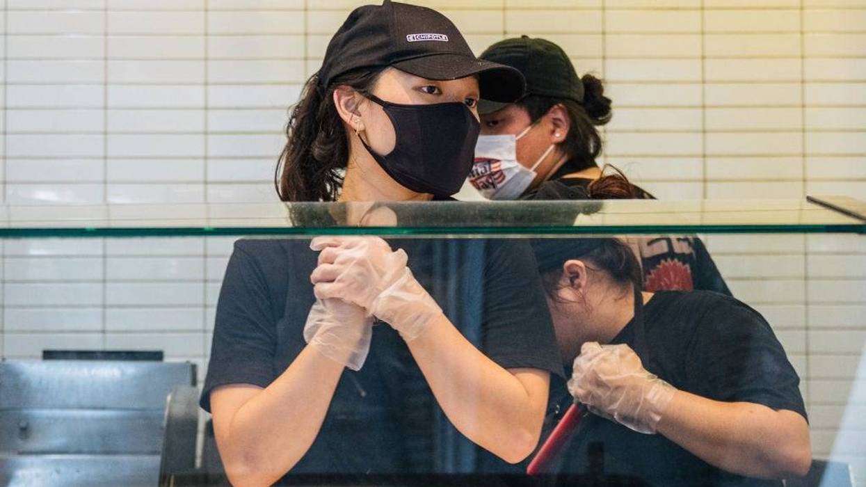 Employees are shown working at a Chipotle Mexican Grill on June 09, 2021 in Houston, Texas.