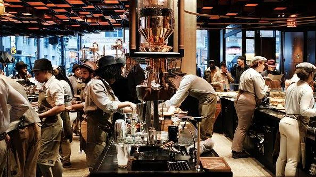 Employees serve customers at a Starbucks Reserve Roastery
