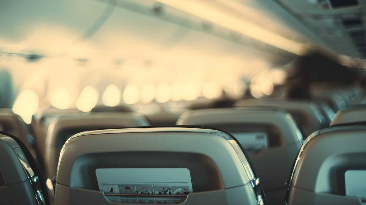 Empty airline cabin stock photo.