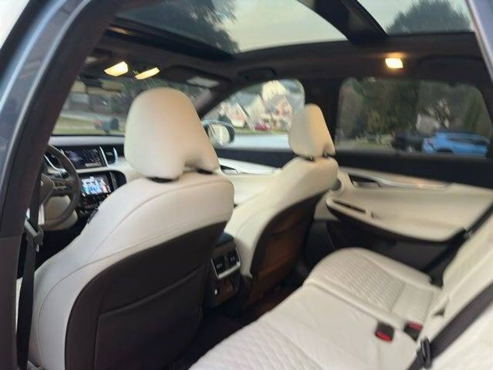Empty back seats of a car, showcasing spaciousness and a clean interior.