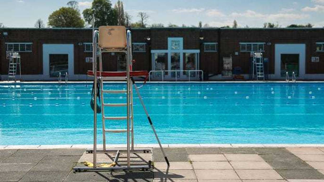 empty lifeguard stand at the pool