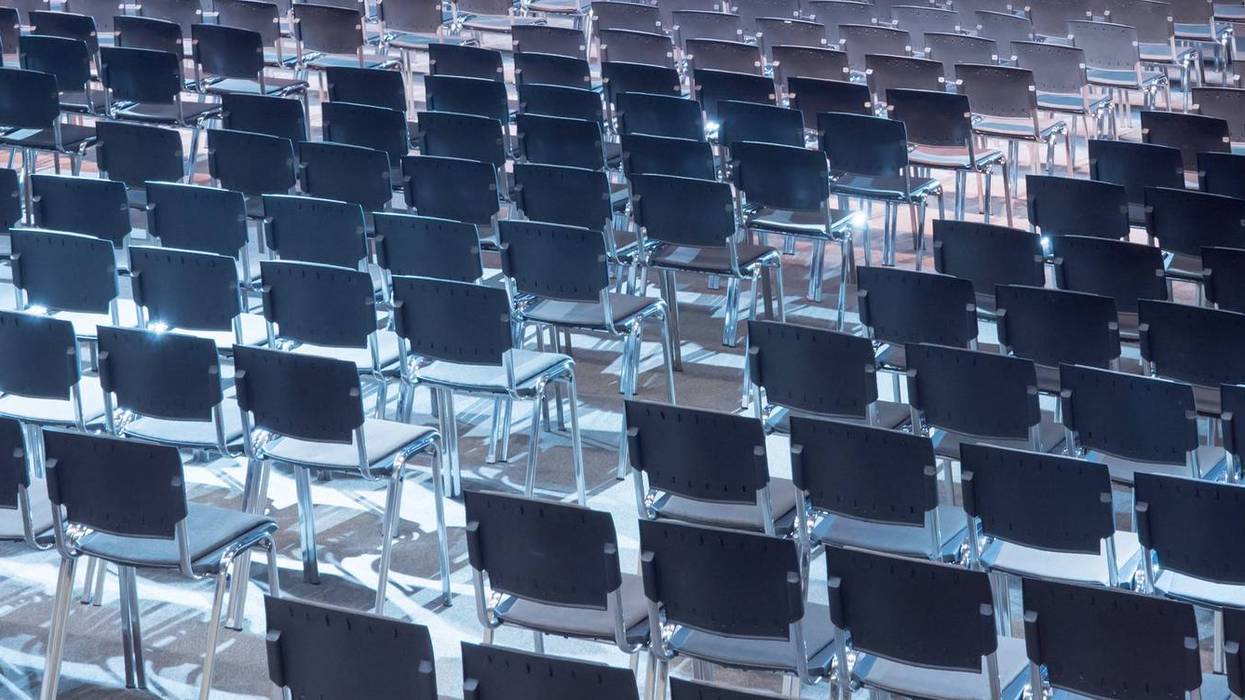 Empty seats. Equipped conference hall. Indoor business conference. Interior of a congress hall. Cancelled meetings, lectures, lessons, forums due to global disease. Online event. Web conference. - stock photo