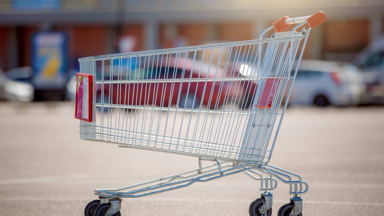 empty shopping cart in a parking lot stock image