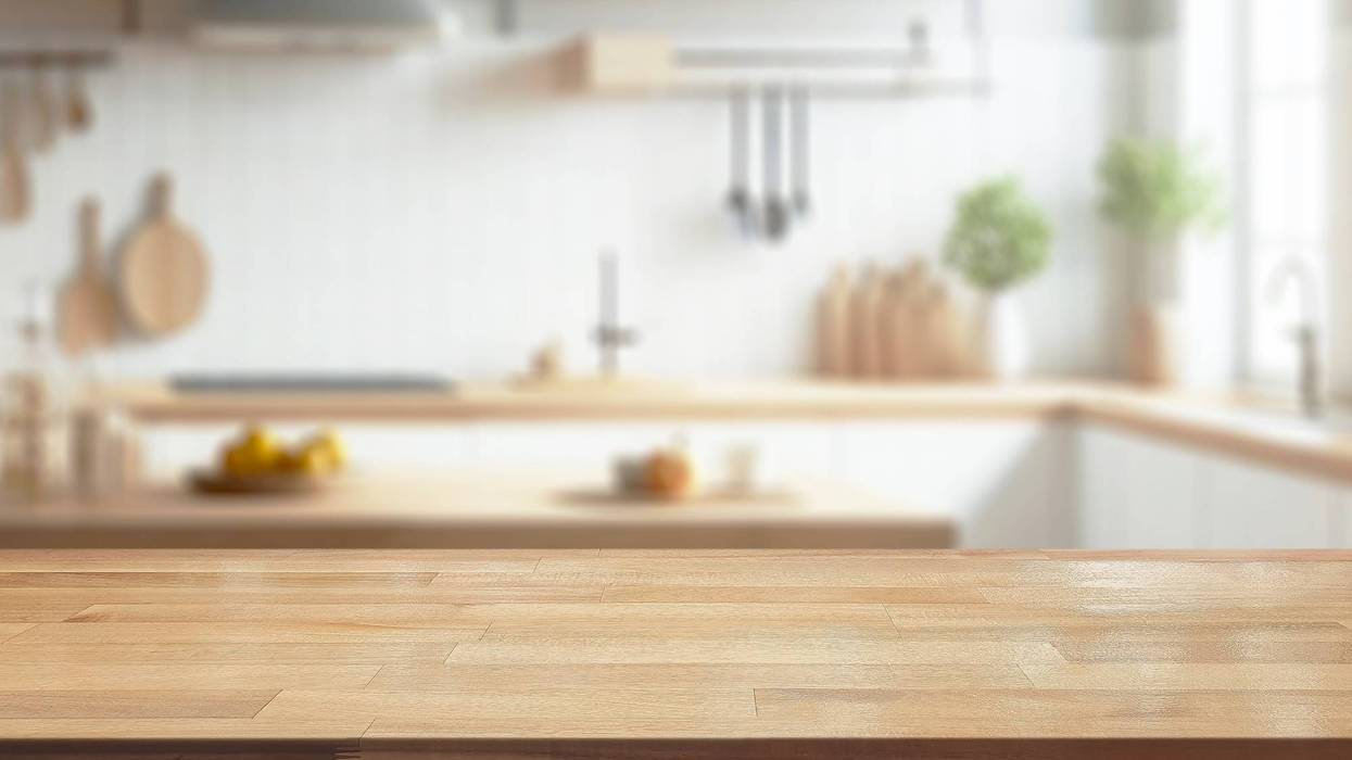 Empty table front kitchen blurred background.