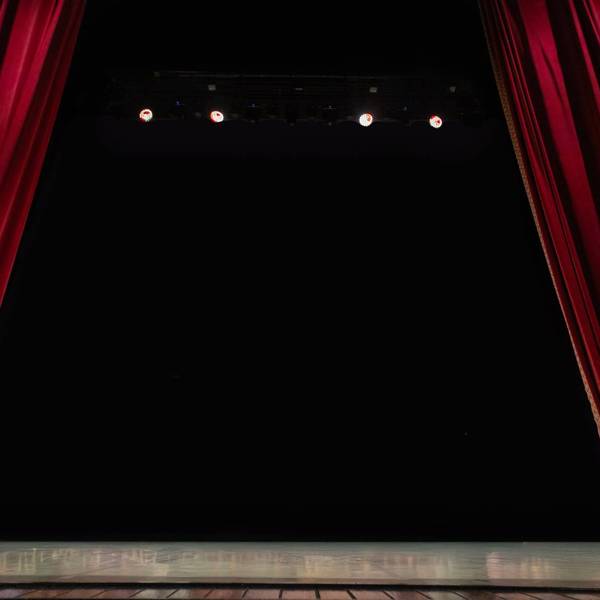Empty Theater Stage with Open Red Velvet