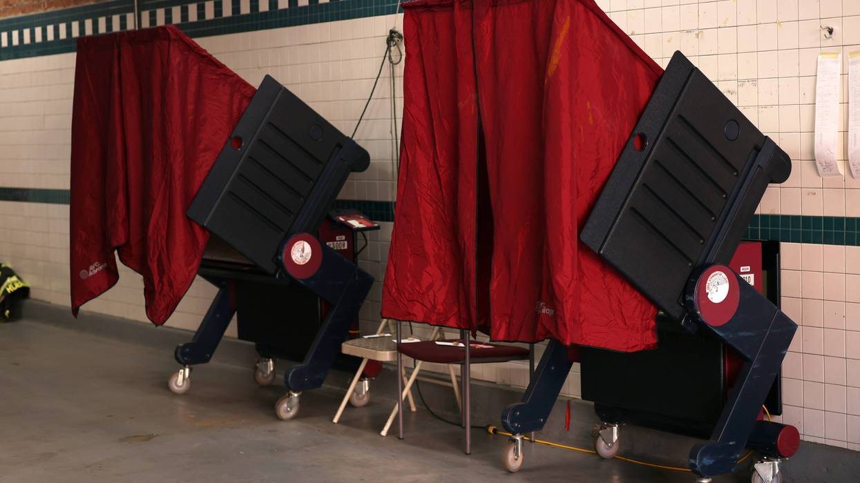 Empty voting booths are seen at a New Jersey fire station. 12 congressional districts in the state will see general elections on Nov. 8.