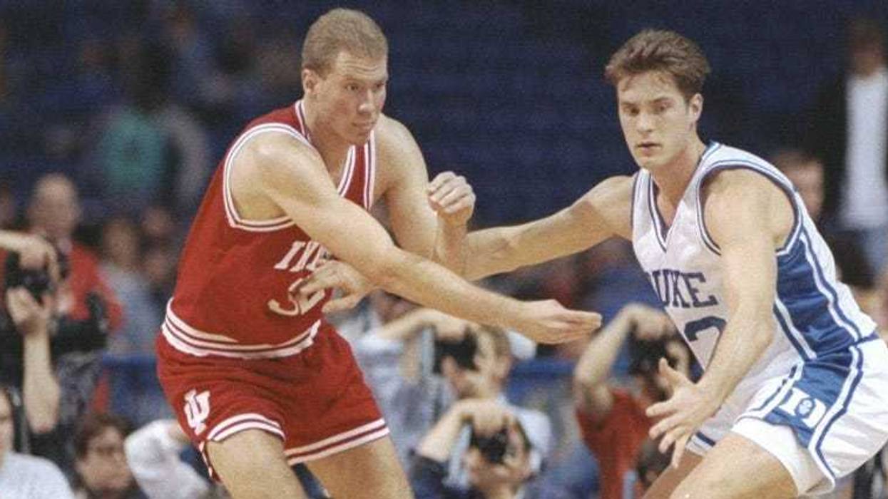 Eric Anderson of the Indiana Hoosiers tries to fend off center Christian Laettner of the Duke Blue Devils on April 4, 1992, at the Metrodome in Minneapolis.
