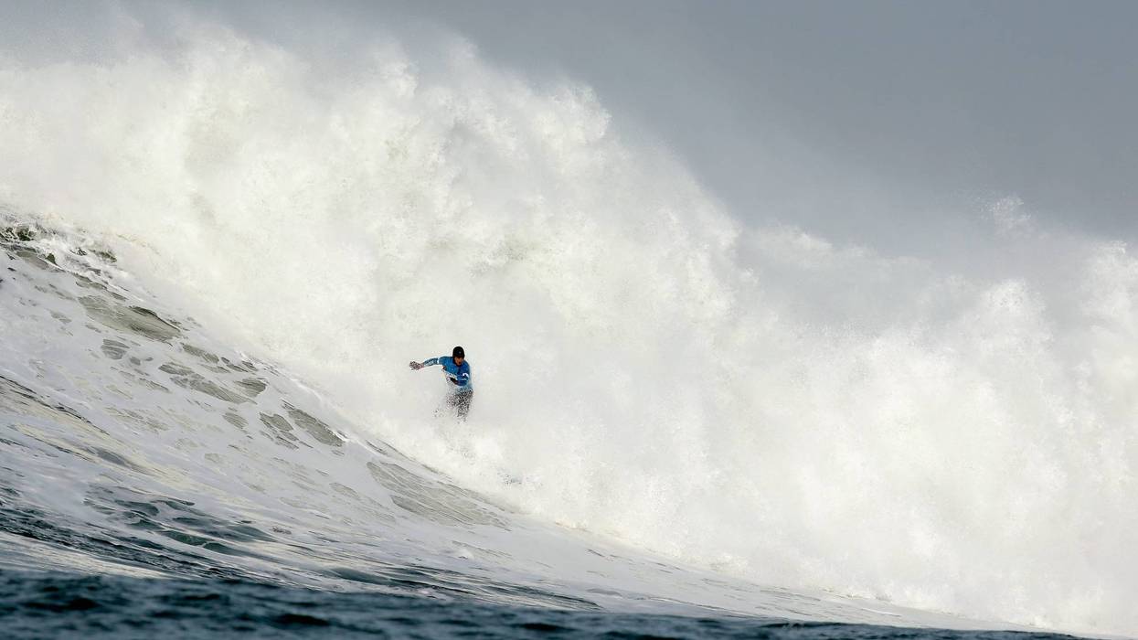 eter Mel rides a wave during the second heat of round one of Mavericks Invitational on January 24, 2014 in Half Moon Bay, California.