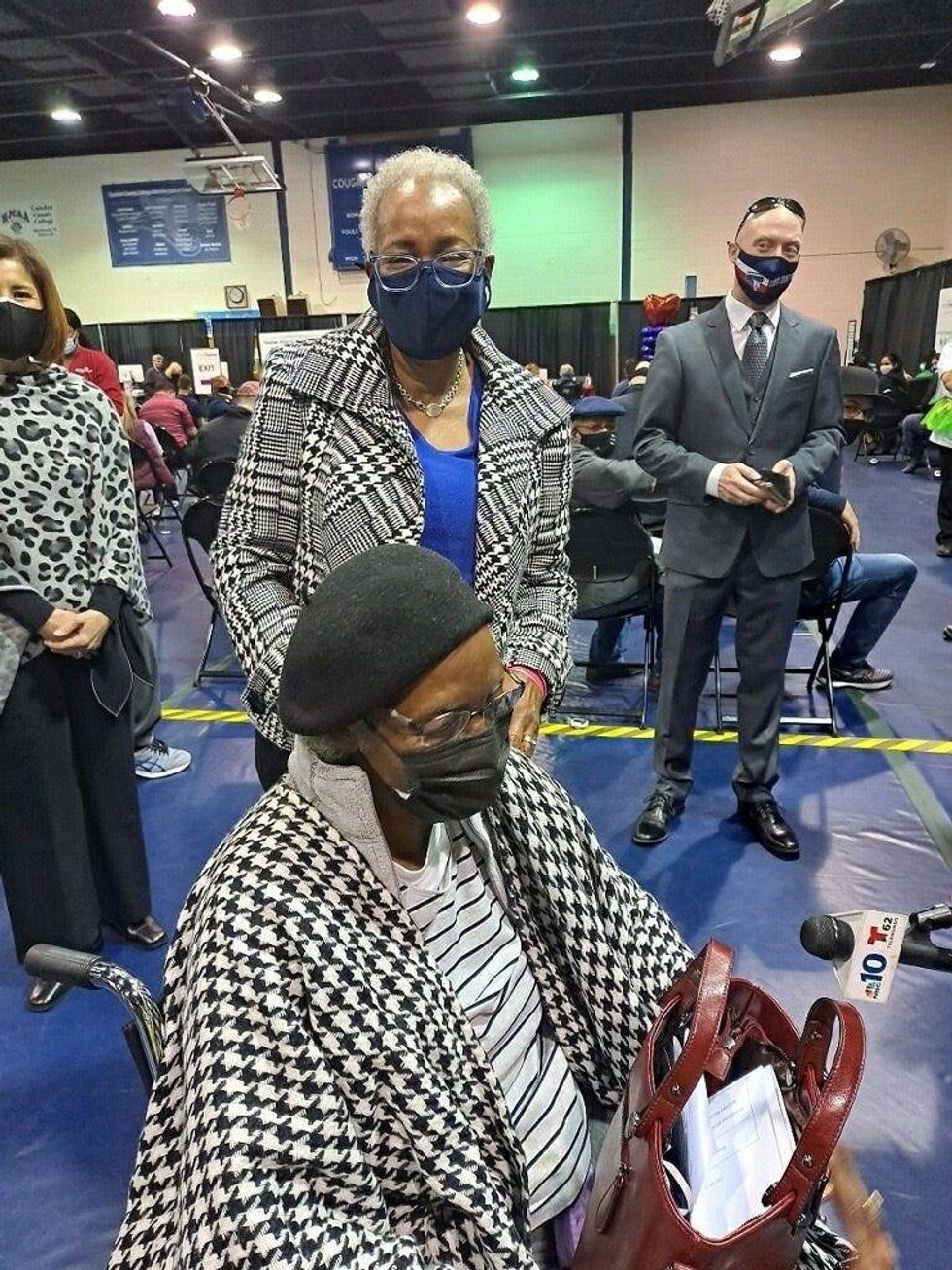 Ethernell Saxon (sitting), accompanied by her daughter Cathy (standing), received her second dose of the COVID-19 vaccine on her 100th birthday on March 10, 2021, in Blackwood, New Jersey.