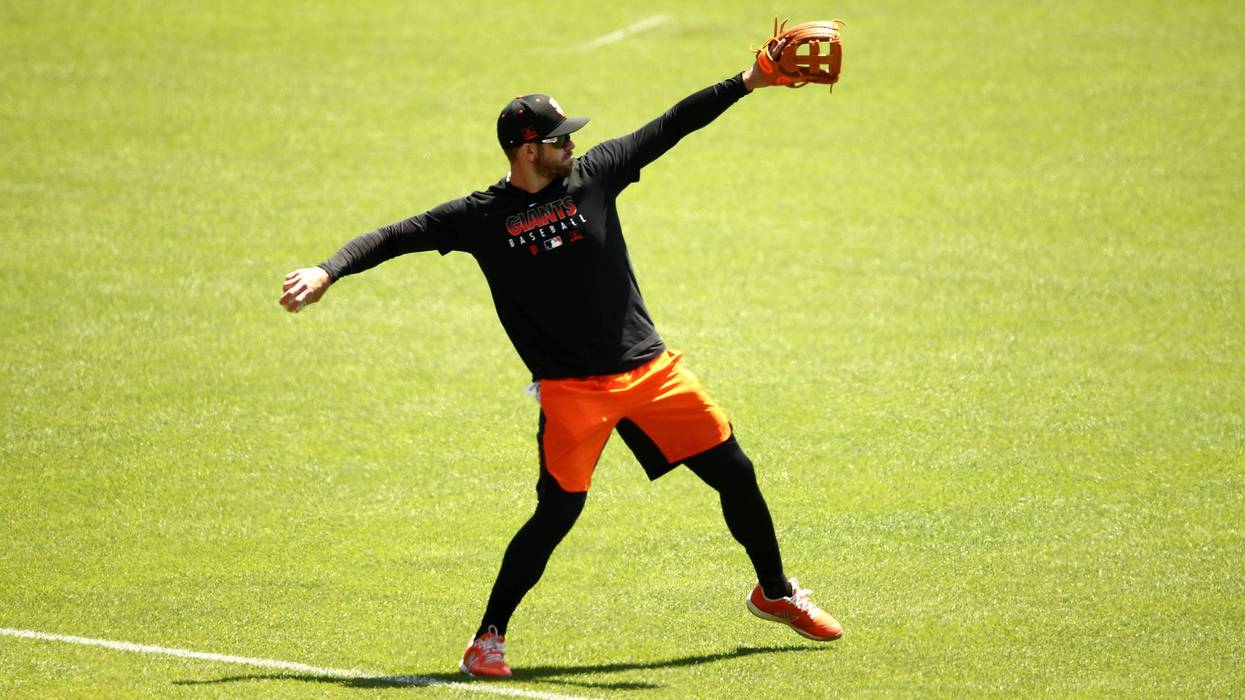 Evan Longoria #10 of the San Francisco Giants plays catch during summer workouts at Oracle Park on July 03, 2020 in San Francisco, California.