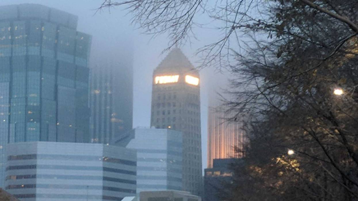Even shrouded in fog and clouds, the iconic name "Foshay" shines bright among the giant glass and steel structures of downtown Minneapolis.